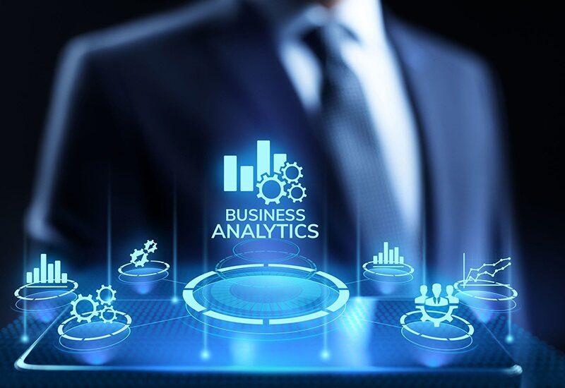 Businessman backgroound wiith Business Analytics Overlay using Icons