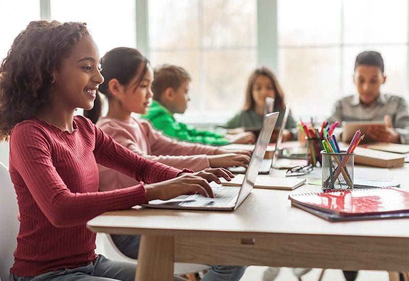 K-12 Modern K-12 Data Infrastructure: Students working with technology in the classroom