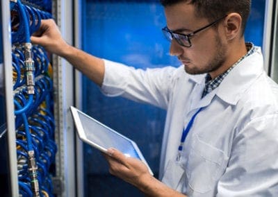 Network Engineer working in data center rack
