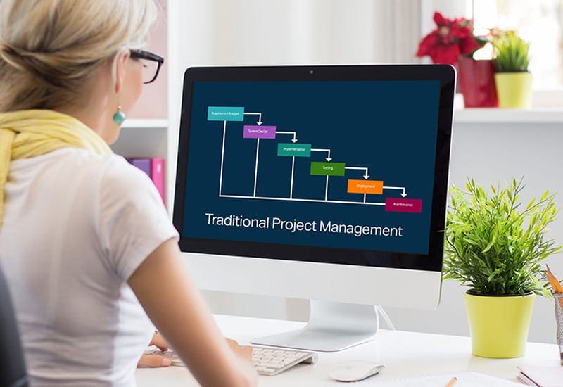 Traditional project planning with waterfall diagram on monitor